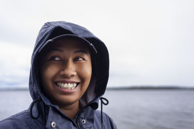 Portrait of smiling woman looking away