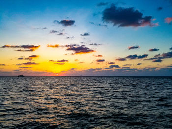 Scenic view of sea against sky at sunset