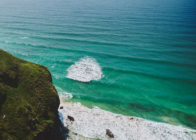 High angle view of rocks on beach near bedruthan steps