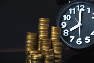 Close-up of coins on black background