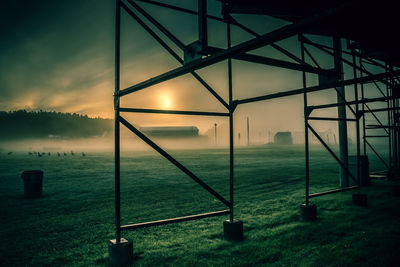 Scenic view of field against sky during sunset