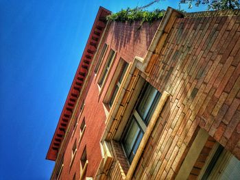 Low angle view of building against blue sky