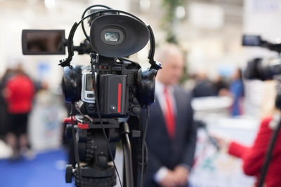 Close-up of video camera during press conference