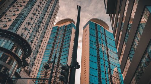 Low angle view of modern buildings against sky