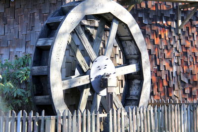 View of machinery on brick wall