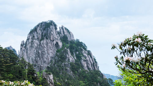 Low angle view of rock formation against sky