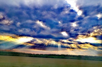Scenic view of dramatic sky during sunset