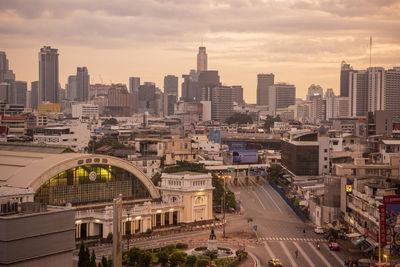 Cityscape against cloudy sky