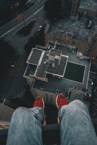 Low section of man over buildings in city