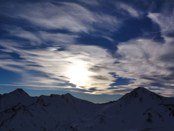 Scenic view of mountains against sky during sunset