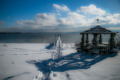 Scenic view of sea against sky during winter