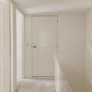 Closed door in hallway at home