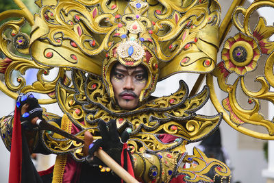 Close-up of portrait of man wearing costume