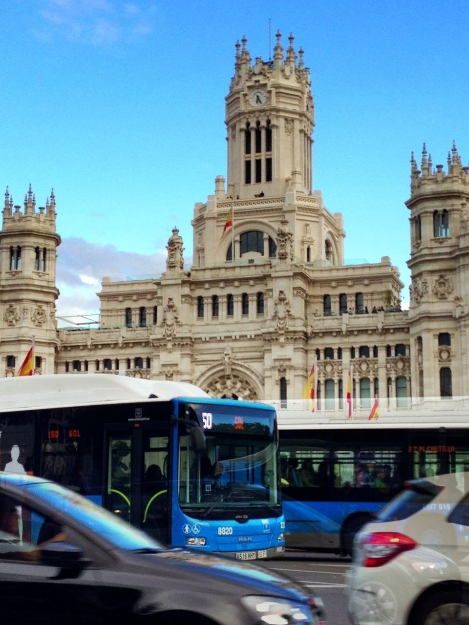 architecture, building exterior, built structure, transportation, clear sky, mode of transport, travel, land vehicle, car, famous place, city, travel destinations, blue, incidental people, tourism, church, capital cities, international landmark, day, religion