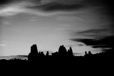 Silhouette built structures at sunset