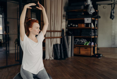 Woman exercising at home