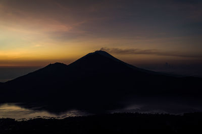 Silhouette mountain against sky during sunset