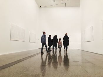 Group of people walking in museum