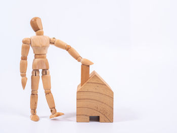 Sculpture of toy on table against white background