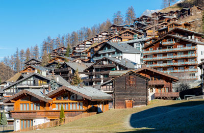 View of buildings against blue sky