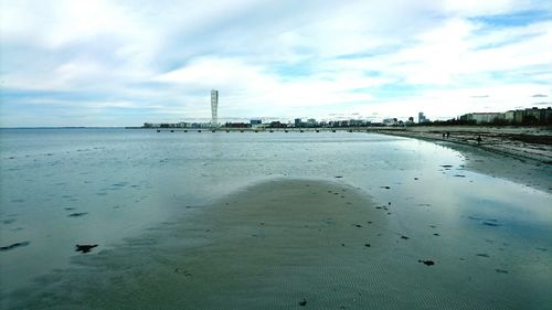 Scenic view of beach against sky