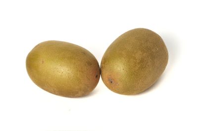 Close-up of fruits against white background