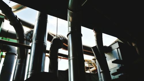 Low angle view of carousel against sky