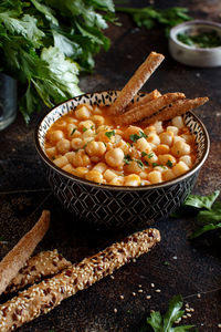 Directly above shot of pasta in container over cutting board