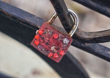 Close-up of love lock on metallic railing