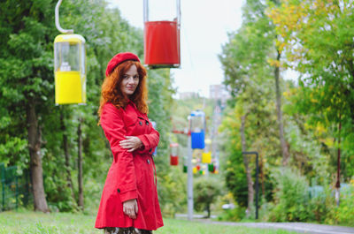 Young happy woman with red hair, freckles, blue eyes in beret in autumn park, smiling. lifestyle