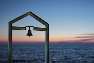 Scenic view of sea against clear sky during sunset