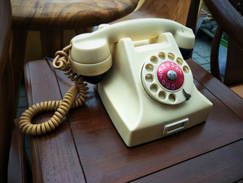 Close-up of telephone booth on table