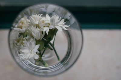 Close-up of white flower vase on table