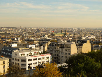 High angle view of buildings in city against sky