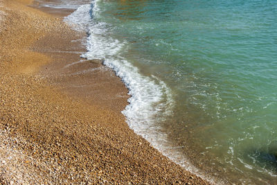 High angle view of surf on beach