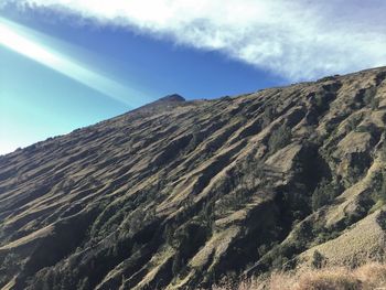 Low angle view of mountain range against sky