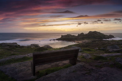 Bench with wonderful views of some ancient ruins on the coast