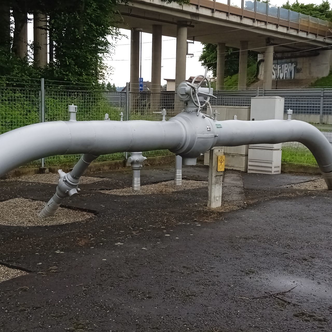 architecture, playground, built structure, public space, pipeline transport, pipe - tube, outdoor play equipment, day, building exterior, pipe, no people, nature, metal, outdoors, pipeline, city, park, tree, park - man made space