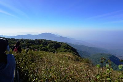 Scenic view of mountains against blue sky