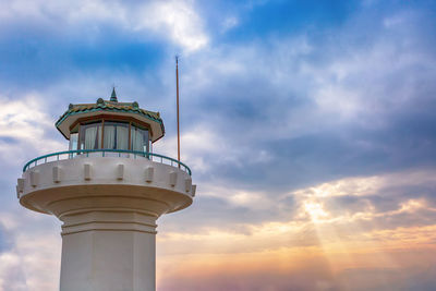 Low angle view of lighthouse against sky during sunset