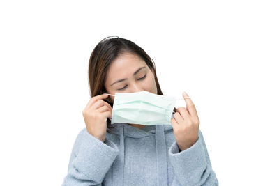 Portrait of a beautiful young woman over white background