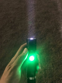 Close-up of hand holding illuminated light