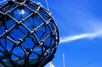 Low angle view of wire against blue sky