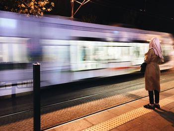 Blurred motion of train at railroad station