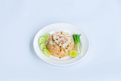 Directly above shot of food in bowl on white background