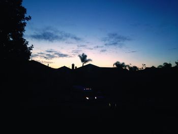 Silhouette of built structures at sunset