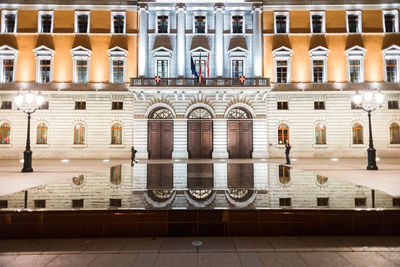 Reflection of building in city street