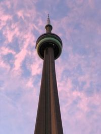 Low angle view of cn tower against cloudy sky