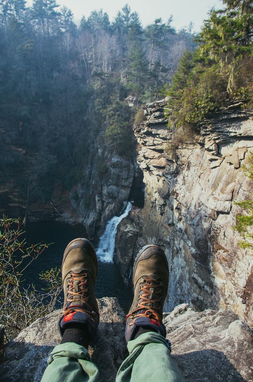 low section, personal perspective, shoe, one person, human body part, lifestyles, real people, outdoors, human leg, day, tree, nature, men, water, one man only, people