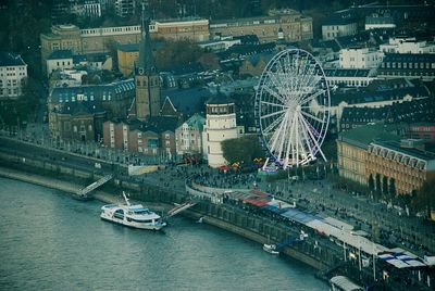 High angle view of ferris wheel in city